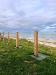 Timber post & glass balustrade with a view of the Norfolk coastline, offering a perfect blend of safety and scenic beauty.