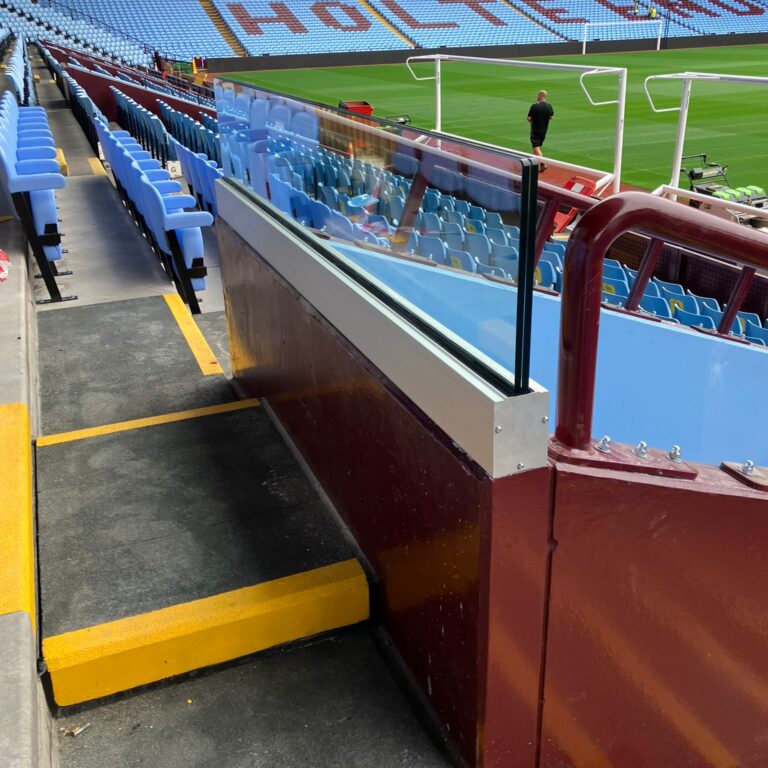 Aston Villa Installation of 25.5mm laminate glass and track system at Aston Villa Football Ground, providing a clear, secure barrier between the stands and the pitch.