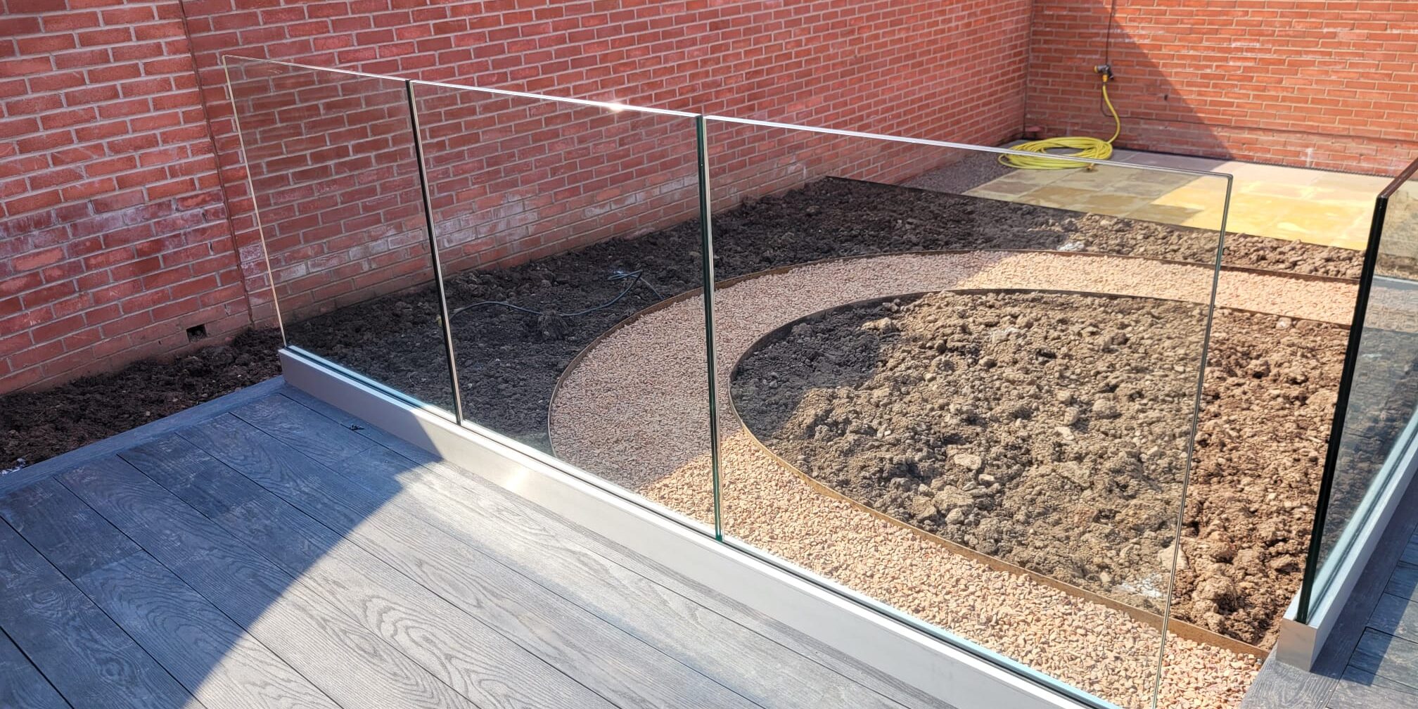 Frameless glass balustrade with base fix track in Shropshire