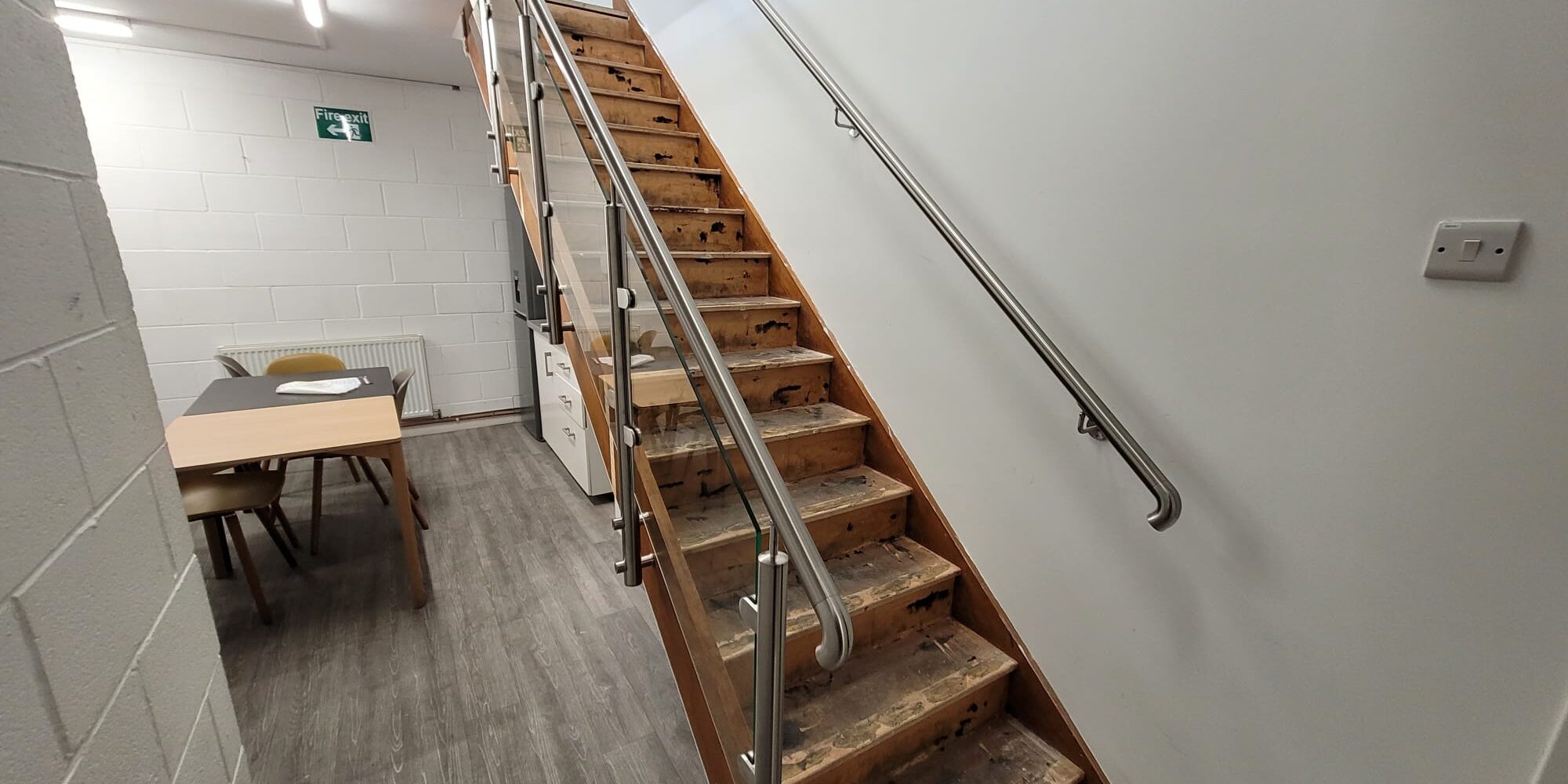 Glass balustrades and stainless-steel handrails installed on a staircase and mezzanine in Warwick.
