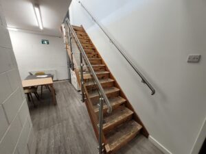 Glass balustrades and stainless-steel handrails installed on a staircase and mezzanine in Warwick.