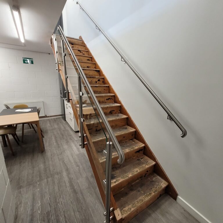 WhatsApp Image 2024-11-21 at 11.42.30_a66796e4 Glass balustrades and stainless-steel handrails installed on a staircase and mezzanine in Warwick.