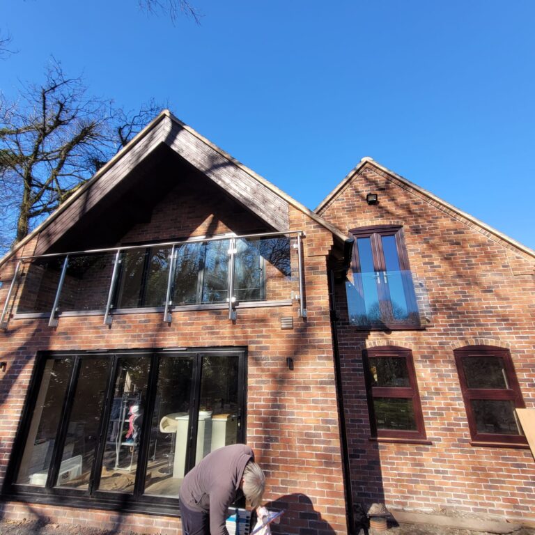 IMG-20250319-WA0006 Stainless steel and glass balustrade installed on a balcony in Telford, providing modern safety and style.