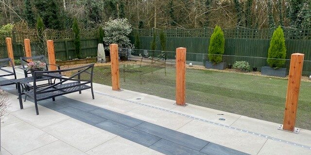 Frameless glass balustrade with timber posts on a Southampton patio