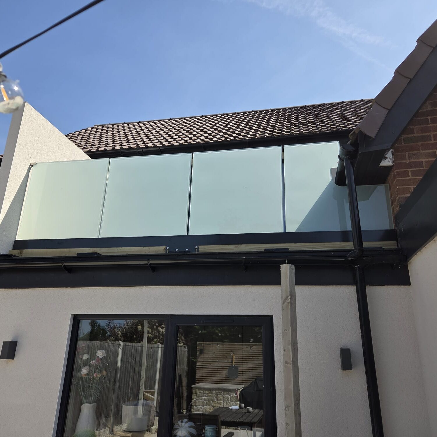 Frameless Glass Balustrades 6 side view of frosted glass balustrade decking with return wall clamps