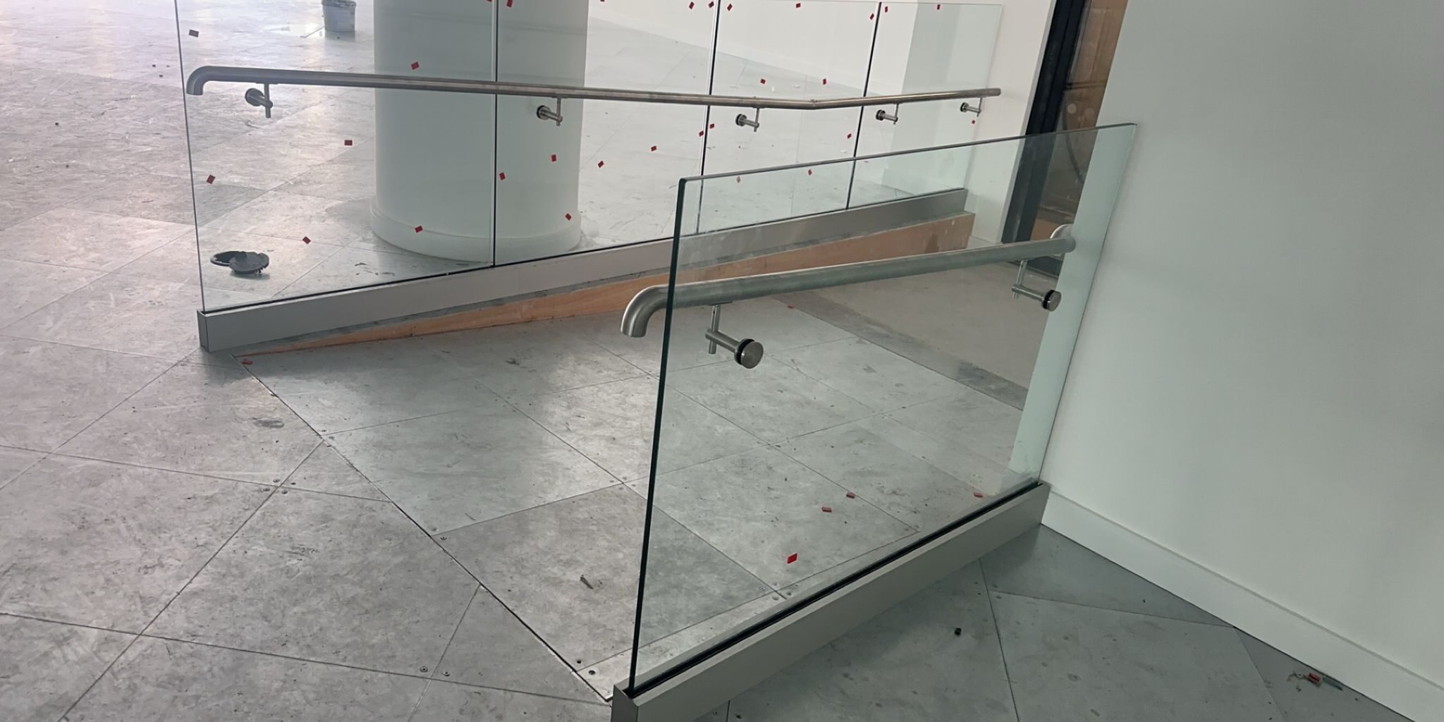 glass balustrades for internal ramps – wall handrail detail in Birmingham office