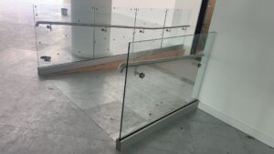 glass balustrades for internal ramps – wall handrail detail in Birmingham office