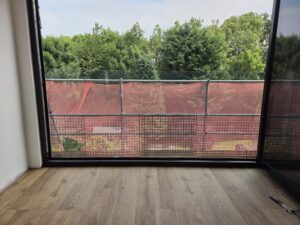 view from inside behind frameless juliet balcony installation