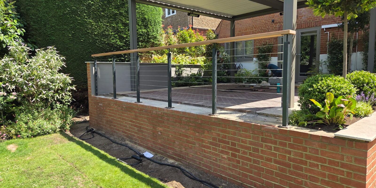 decking balustrade with timber top rail and stainless wire cables