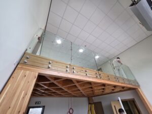 frameless balustrade installation with boss fixings to timber fascia