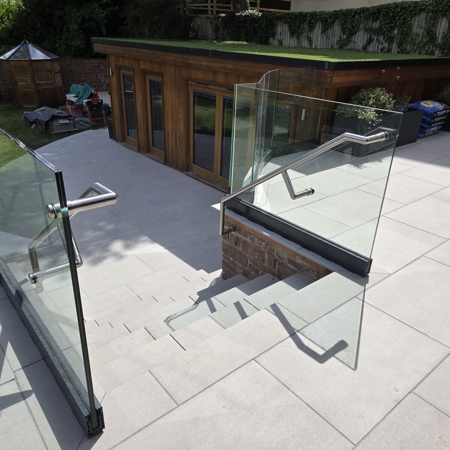Staircase Balustrades 7 clean glass balustrade installation on outdoor stairway with steel handrails