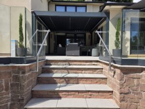 modern stair balustrade with frameless glass and satin stainless steel handrails
