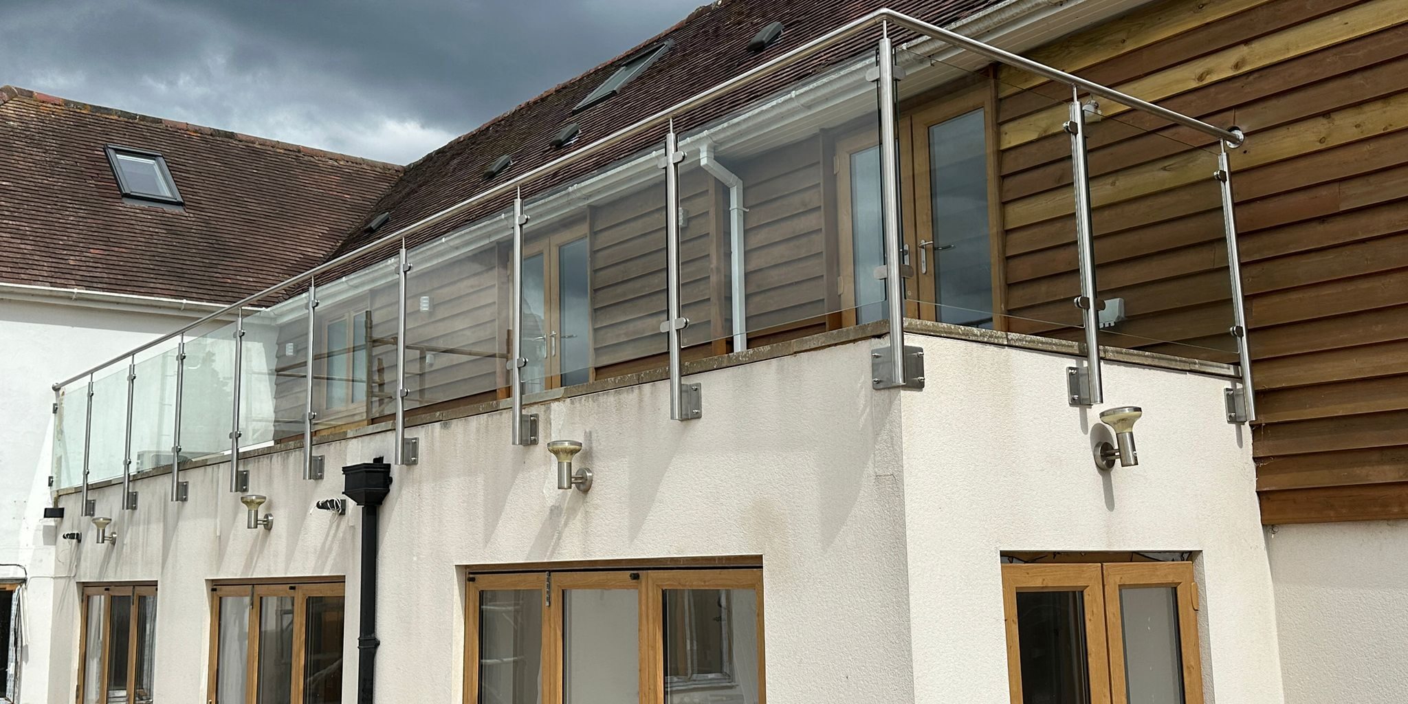 WhatsApp Image 2025-07-24 at 09.34.54_57e2334d side-fix stainless steel and glass balustrade on terrace edge