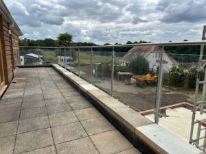 side-fixed stainless steel glass balustrade overlooking garden