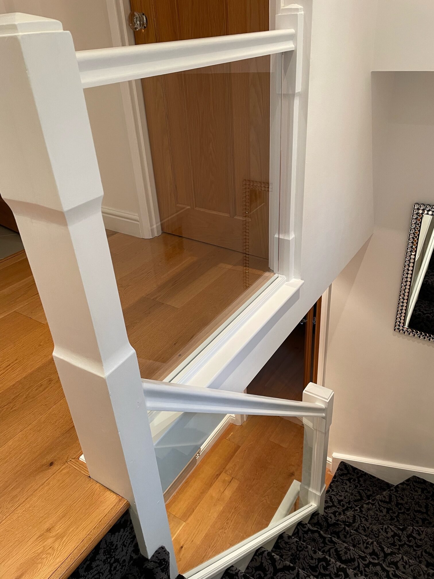 Staircases with Clamps 11 Upstairs landing with glass staircase banister infill