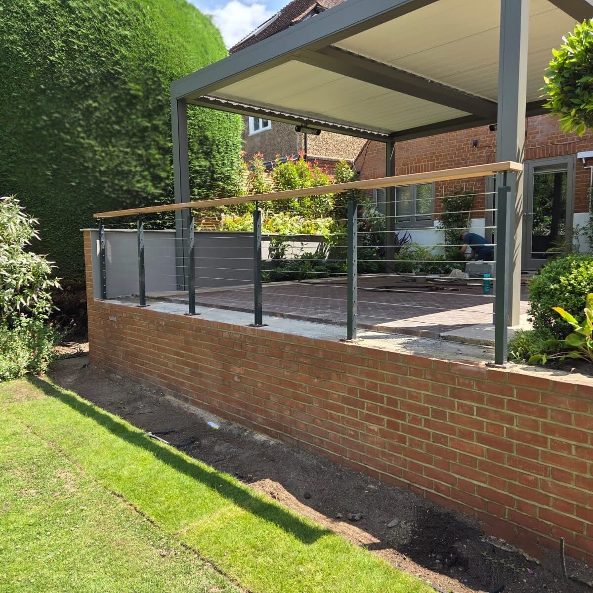 Wire Balustrade Systems 5 Wire balustrade with timber handrail in modern garden powder coated back view