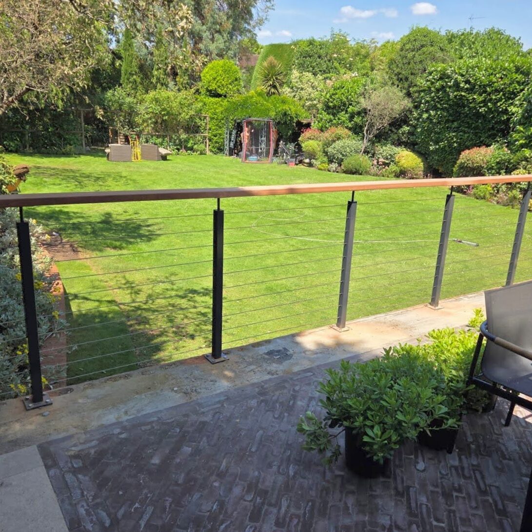 Wire Balustrade Systems 6 Wire balustrade with timber handrail in modern garden powder coated