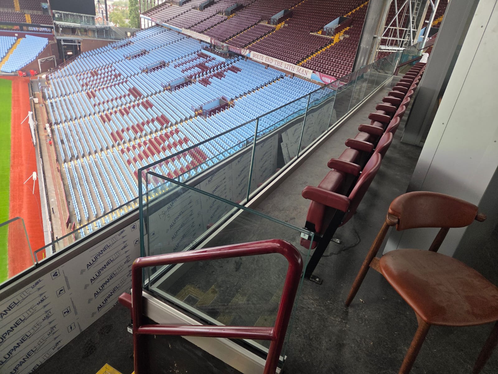 villa-park-heavy-duty-glass-track Glass panels held in a heavy-duty balustrade track at Villa Park