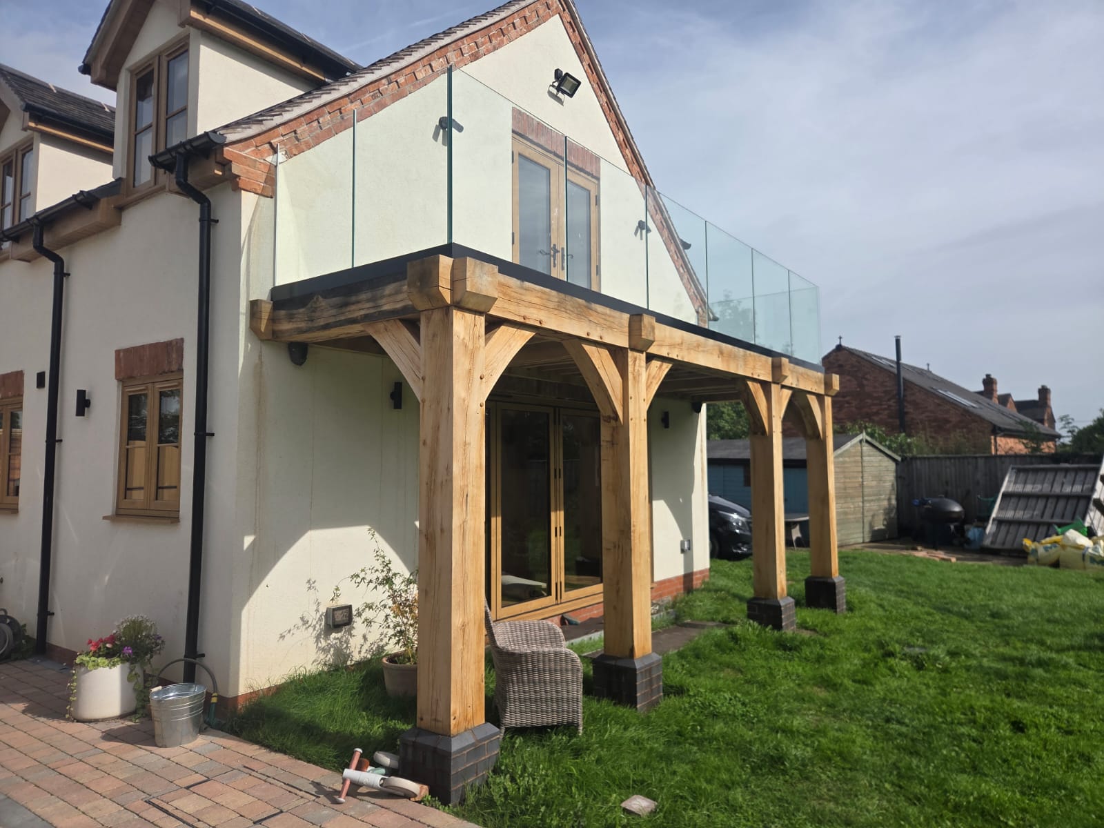 Clear toughened laminated glass panels set into a powder-coated base track